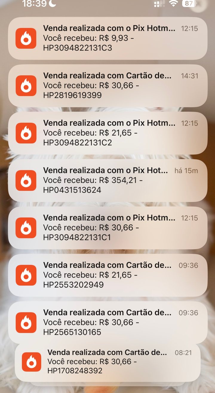 Notificações de venda da Hotmart chegando no celular da Claudia